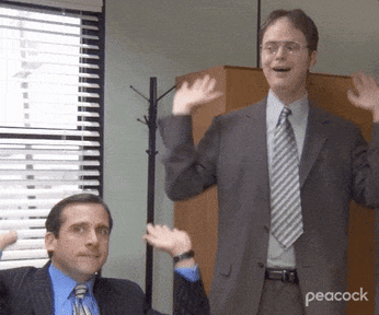 Personajes de "The Office" moviendo animadamente los brazos.